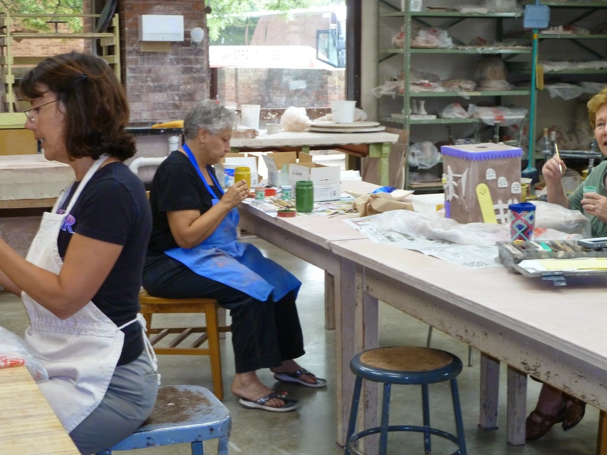 Artists working on ceramics.